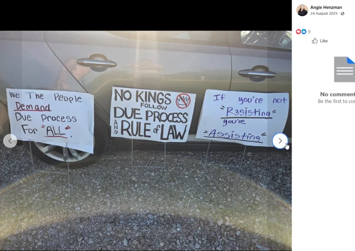 Three handwritten placards are propped against a parked vehicle on gravel. Their messages call for due process, the rule of law, and resisting rather than assisting.
